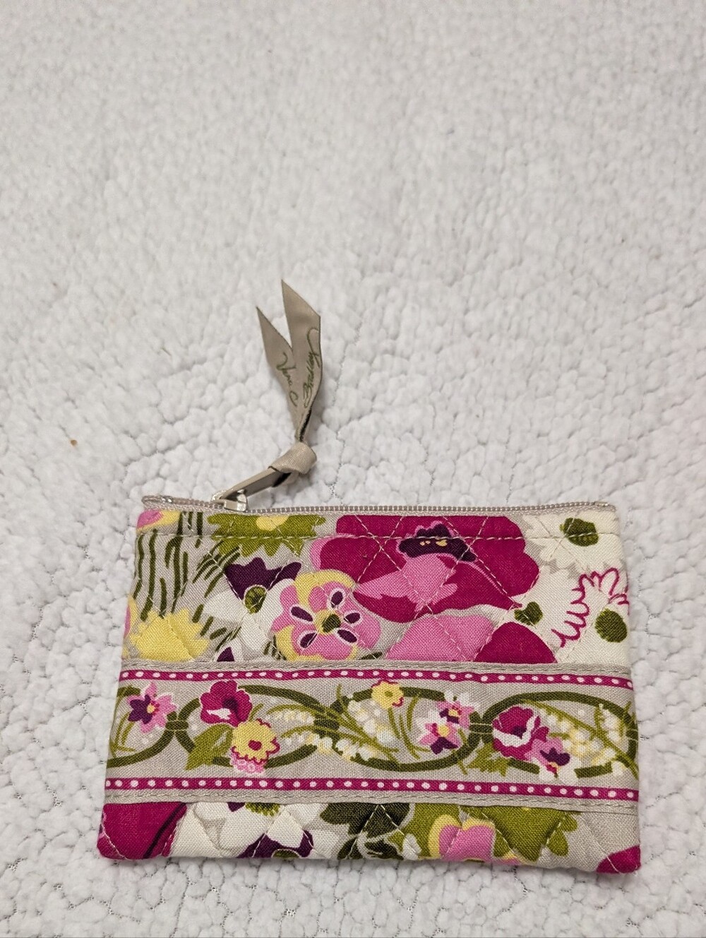 Vera Bradley quilted wristlet wallet featuring a pink, green, and tan floral